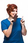 Curvy Woman Eating Chocolate Stock Photo