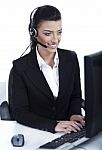 Customer Support Woman With Headset At Office Stock Photo