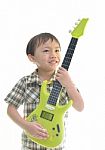 Cute Asian Boy Playing Guitar Stock Photo