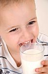 Cute Child Drinking Milk Stock Photo