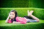 Cute Girl In Green Nature Hammock Stock Photo