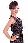 Cute Girl Wearing Spectacles With Hands On Hips Stock Photo