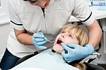 Cute Kid Examined By Dentist Stock Photo