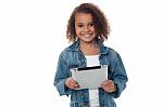 Cute Little Girl Holding Tablet Pc Stock Photo