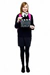 Cute School Girl With A Clapperboard Stock Photo