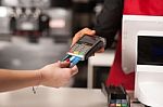 Debit Card Swiping On Card-reader Device Stock Photo