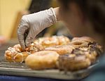 Decorating The Donuts Stock Photo