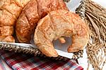 Delicious Fresh Croissants With Rice On Wooden Background Stock Photo