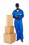 Delivery Boy Holding Clipboard Stock Photo
