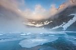 Dent Fog Over Iceberg Lake, Glacier National Park Stock Photo