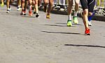 Detail Of A Group Of Runners During A City Marathon Stock Photo