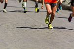 Detail Of A Group Of Runners During A City Marathon Stock Photo