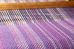 Detail Of Fabric In Comb Loom With Ultraviolet And Lilac Colors Stock Photo