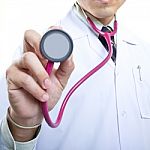 Doctor Holding Stethoscope Stock Photo