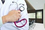 Doctor Holding Stethoscope Stock Photo