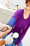 Doctor Measuring Blood Pressure Stock Photo
