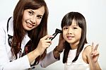 Doctor Used Otoscope For Examining Child's Ears Stock Photo
