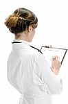 Doctor Writing On Paper Stock Photo