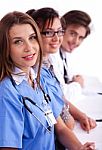 Doctors In Hospital Gowns In Row Stock Photo