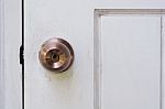 Door Knob And Keyhole On White Wooden Door Stock Photo