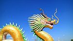 Dragon Statue Under Blue Dragon Sky Stock Photo