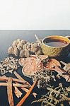 Dried Herbs And Ginseng, Top View Of Thai Herbs And Ginseng On Wooden Floor Stock Photo
