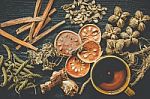 Dried Herbs And Ginseng, Top View Of Thai Herbs And Ginseng On Wooden Floor Stock Photo