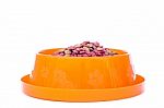 Dry Cat Food In Orange Bowl Isolated On White Background Stock Photo