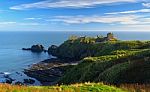 Dunnottar Castle With Blue Sky Background In Aberdeen, Scotland Stock Photo
