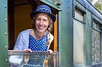 Dutch Woman In Old-fashioned Clothes In Window Of Steam Train Stock Photo
