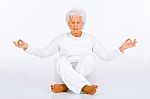 Elderly Woman Practicing Yoga Stock Photo