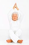 Elderly Woman Practicing Yoga Stock Photo