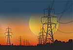 Electricity Pylons At Sunset Stock Photo
