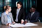 Employer Explaining Business Plan To His Colleagues Stock Photo