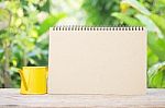 Empthy Calendar And Yellow Mini Watering Can Stock Photo