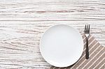 Empty Plate Napkin Fork Silverware White Wooden Table Background Stock Photo