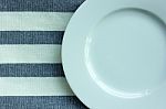 Empty White Plate With Tablecloth Stock Photo