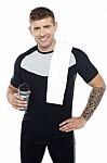 Energetic Fit Man Holding Water Bottle Stock Photo