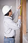 Engineer Man Metering By Tape Measure Stock Photo