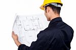 Engineer Reviewing Blueprint Stock Photo