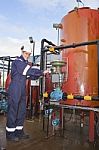 Engineer Working With Oil Refinery Stock Photo