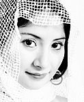 Ethnic Muslim Woman With A  Netted Headscarf Stock Photo