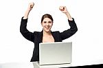 Excited Businesswoman Raising Her Arms Up Stock Photo