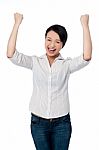 Excited Charming Girl With Clenched Fists Stock Photo
