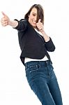 Excited Woman Showing Thumbs Up Gesture Stock Photo