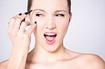 Excited Woman Using Eyebrow Pencil Stock Photo