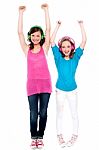 Excited Young Girls Enjoying Music Stock Photo