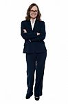 Executive In Business Attire Standing Arms Folded Stock Photo