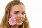 Face Of Girl With Flower In Her Mouth Stock Photo