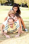 Family Lying On Top Of Each Other Stock Photo